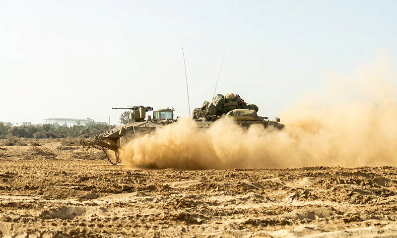 An Israeli military vehicle operates in the Gaza Strip on December 27, 2023. &mdash; Reuters