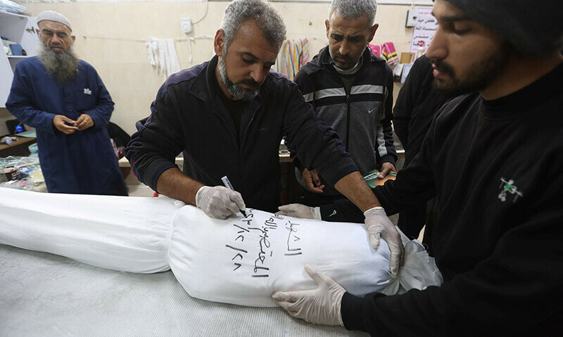In Gaza, rows of white shrouds symbolise mounting civilian deaths