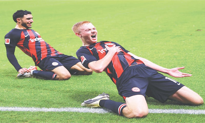 FRANKFURT: Eintracht Frankfurt’s Hugo Larsson (R) celebrates after scoring during the Bundesliga match against Bayern Munich at Deutsche Bank Park.—Reuters FRANKFURT: Eintracht Frankfurt’s Hugo Larsson (R) celebrates after scoring during the Bundesliga match against Bayern Munich at Deutsche Bank Park.—Reuters