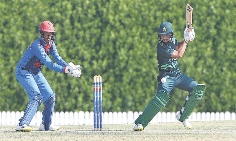 Pakistan batter Mohammad Riazullah plays a shot as Afghanistan wicket-keeper Numan Shah looks on during the Under-19 Asia Cup match at the ICC Academy on Tuesday.&mdash;courtesy PCB