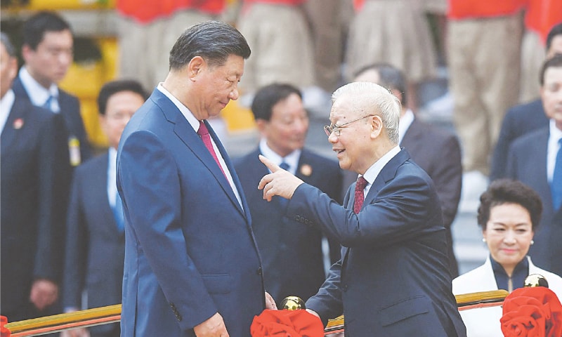 Hanoi: President Xi Jinping (left) and Nguyen Phu Trong, Vietnam Communist Party’s General Secretary, attend a welcome ceremony at the Presidential Palace, on Tuesday.—AFP Hanoi: President Xi Jinping (left) and Nguyen Phu Trong, Vietnam Communist Party’s General Secretary, attend a welcome ceremony at the Presidential Palace, on Tuesday.—AFP