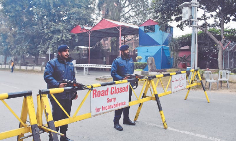 Police personnel stand alert outside St Thomas Church in Islamabad on Sunday. &mdash;Online