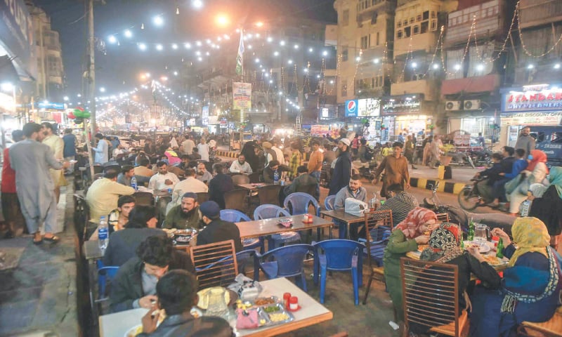 Foodies enjoy local cuisine at the Ist International Burns Road Food Festival.&mdash;Fahim Siddiqi / White Star