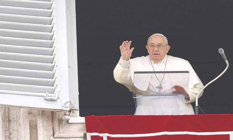 VATICAN CITY: Pope Francis leads the Angelus prayer from his window, in St. Peter&rsquo;s Square, on Christmas Eve.&mdash;Reuters