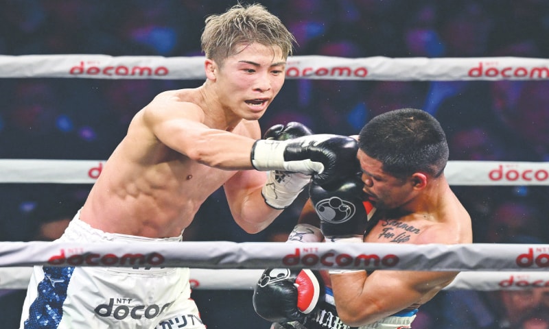 TOKYO: Japan&rsquo;s Naoya Inoue lands a punch on Marlon Tapales of the Philippines during their four-belt world super bantamweight title unification match at Ariake Arena on Tuesday.&mdash;AFP