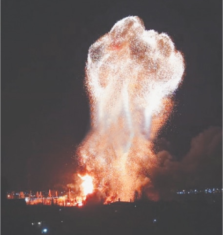 A huge fire erupts after an explosion following a  Ukrainian attack in the port of Feodosiya, in 
Russian-controlled Crimea.&mdash;AFP