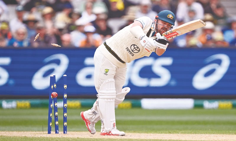 AUSTRALIAN batter Travis Head is cleaned up by Pakistan pacer Mir Hamza during the second Test at the Melbourne Cricket Ground 
on Thursday.&mdash;AFP