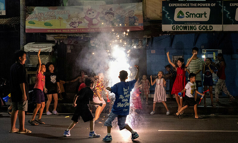 Children play during New Year’s Eve celebrations at a street in Mandaluyong, Metro Manila, Philippines, December 31, 2023. — Reuters
