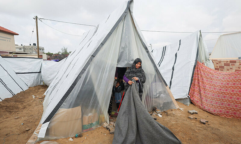 Displaced Palestinians, who fled their home due to Israeli strikes, shelter at a tent camp in Rafah, southern Gaza Strip, January 2, 2024. &mdash; Reuters