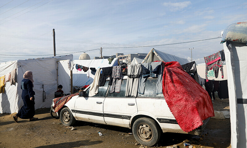 Displaced Palestinians, who fled their homes due to Israeli strikes, shelter in a tent camp, amid the ongoing Israel bombardment in Rafah, southern Gaza Strip, on January 3. &mdash; Reuters
