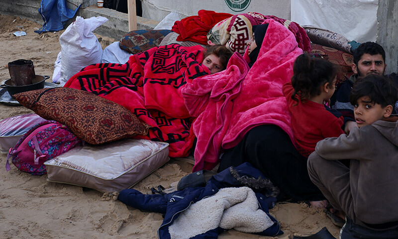 Displaced Palestinians, who fled their homes due to Israeli strikes, shelter in a tent camp, amid the ongoing Israel bombardment in Rafah, southern Gaza Strip, on January 3. &mdash; Reuters