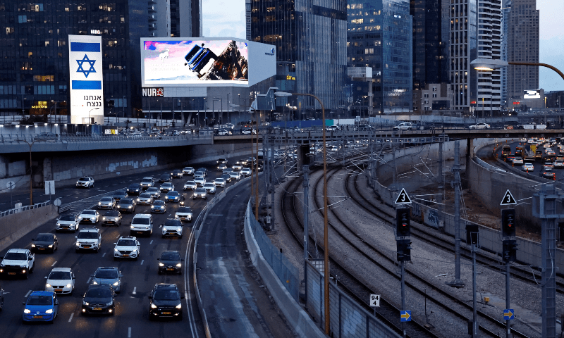  A giant Israeli flag is seen on a billboard with a message in Hebrew saying &lsquo;we will win&rsquo; in Tel Aviv, Israel on Jan 3, 2024. &mdash; Reuters 