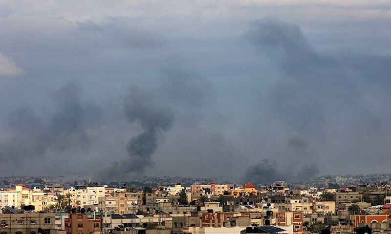 Smoke billows over Khan Yunis in the southern Gaza Strip amid Israeli bombardment. &mdash; AFP