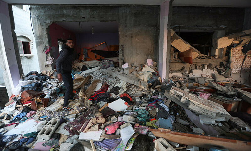 A Palestinian man inspects a house damaged in an Israeli strike in Rafah, in the southern Gaza Strip, January 5, 2024. &mdash; Reuters