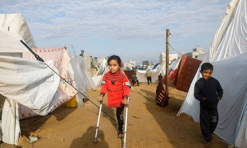 Displaced Palestinian kids, who fled their homes due to Israeli strikes, shelter in a tent camp, in Rafah, southern Gaza Strip, January 5, 2024. &mdash; Reuters