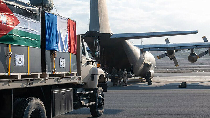 French-Jordanian humanitarian aid is being loaded into a military cargo plane at an undisclosed location in Jordan before being airdropped over Khan Yunis and a Jordanian field hospital in the Gaza Strip. &mdash; AFP