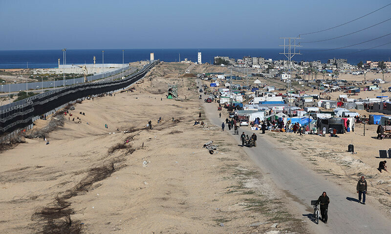 Displaced Palestinians, who fled their houses due to Israeli strikes, seek shelter near the border with Egypt, in Rafah in the southern Gaza Strip, January 7, 2024. &mdash; Reuters