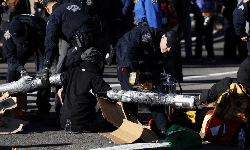 Members of the NYPD Emergency Service Unit attempt with power saws to separate pro-Palestinian demonstrators blocking a Brooklyn Bridge roadway during a &lsquo;Shut it Down for Palestine&rsquo; protest in New York City, USA, on January 8, 2024. &mdash; Reuters