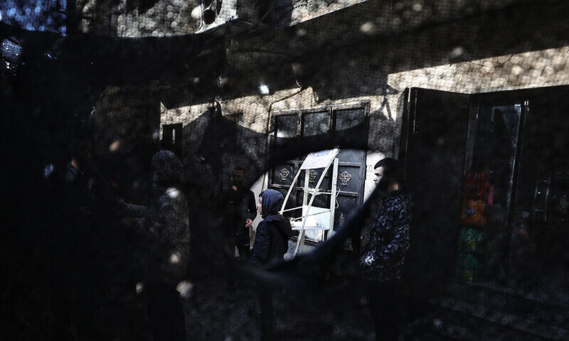 People inspect the damage following an overnight Israeli raid on the Tulkarm refugee camp in the occupied West Bank, on January 9, 2024 &mdash; AFP