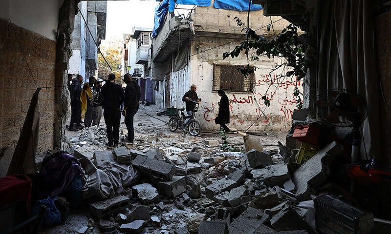 People inspect the damage following an overnight Israeli raid on the Tulkarm refugee camp in the occupied West Bank, on January 9, 2024 &mdash; AFP