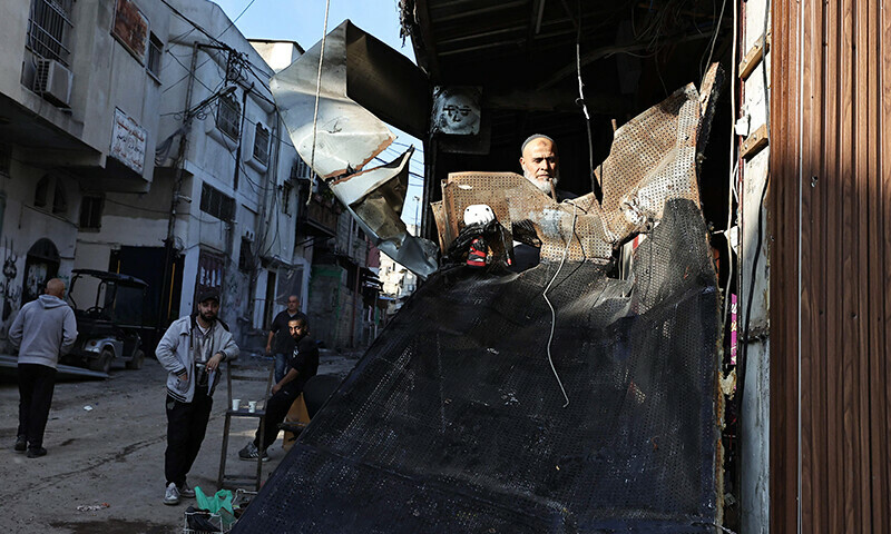People inspect the damage following an overnight Israeli raid on the Tulkarm refugee camp in the occupied West Bank, on January 9, 2024 &mdash; AFP