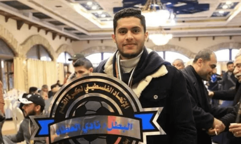 Khalid Abu-Habel with the Gaza third-tier championship trophy that he won with his club Al Ataa in January 2023. &mdash; Photo courtesy Al Jazeera