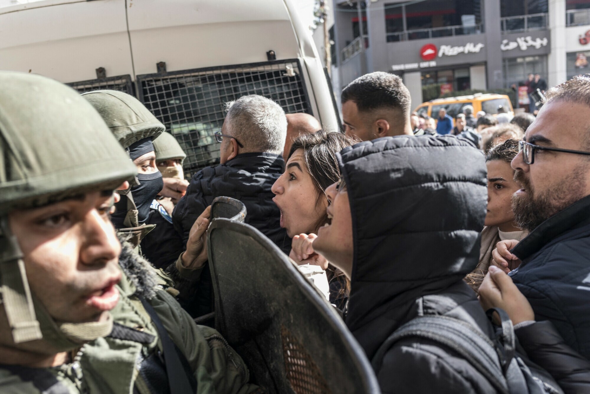 Protesters shout slogans as they are confronted by Palestinian Authority security forces during a protest against a visit by US Secretary of State Antony Blinken in Ramallah in the Israeli-occupied West Bank on January 10. &mdash; AFP
