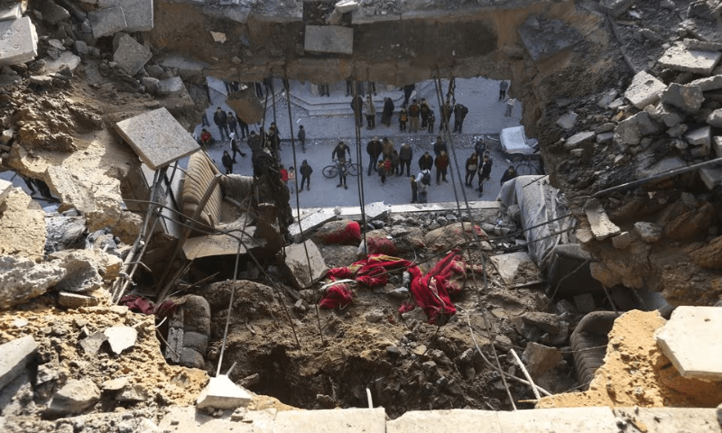 Palestinians gather at the site of an Israeli strike in Rafah in the southern Gaza Strip January 10, 2024. &mdash; Reuters
