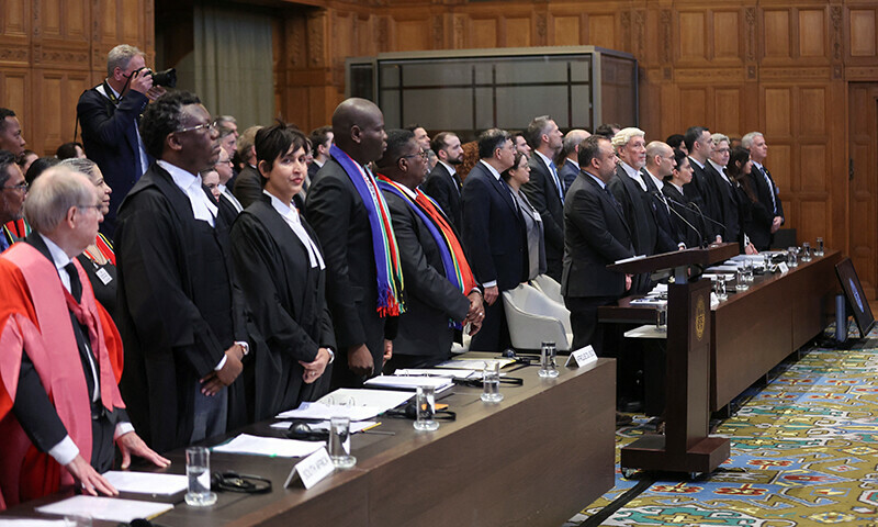 South Africa&rsquo;s Minister of Justice Ronald Lamola, lawyer Adela Hassim and the delegation stand as judges at the International Court of Justice (ICJ) hear a request for emergency measures by South Africa in The Hague, Netherlands on January 11, 2024.&mdash; Reuters