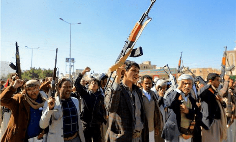 Houthi fighters brandish their weapons during a march in solidarity with the Palestinian people in the Houthi-controlled capital Sanaa on January 11, 2024. &mdash; AFP