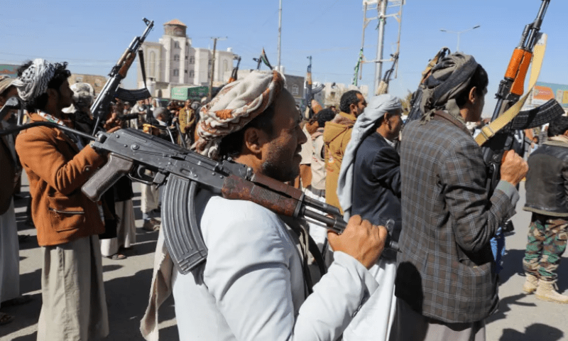 Newly recruited Houthi fighters hold up firearms during a ceremony at the end of their training in Sanaa, Yemen, on January 11. &mdash; Reuters
