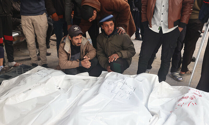 Palestinians mourn over bodies of victims of Israeli bombardment in Rafah in the southern Gaza Strip on January 12, 2024 &mdash; AFP