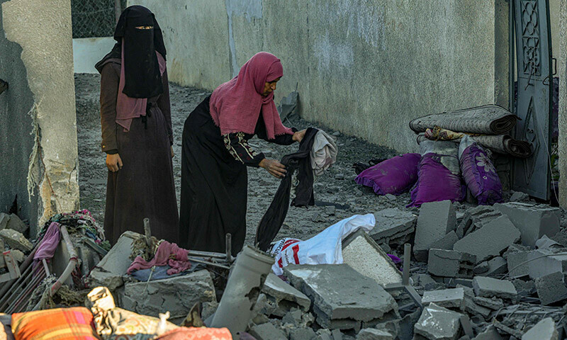 People look for salvageable items amid the rubble following Israeli bombardment in Rafah in the southern Gaza Strip on January 13. &mdash; AFP
