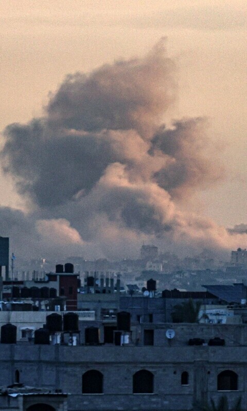  A picture taken from Rafah shows smoke billowing over Khan Younis in the southern Gaza Strip during an early morning Israeli bombardment, as the conflict between Israel and the Palestinian fighter group Hamas enters its 100th day on January 14, 2024.&mdash;AFP 