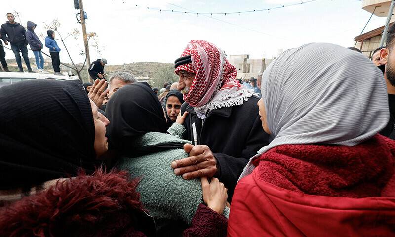 People react during the funeral of two Palestinians killed by Israeli troops, near Hebron in the Israeli-occupied West Bank, January 15, 2024. &mdash; Reuters