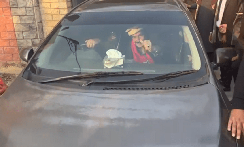 Sheikh Rashid Ahmed is taken from the court by law enforcers after the arrest. &mdash; Photo provided by author.