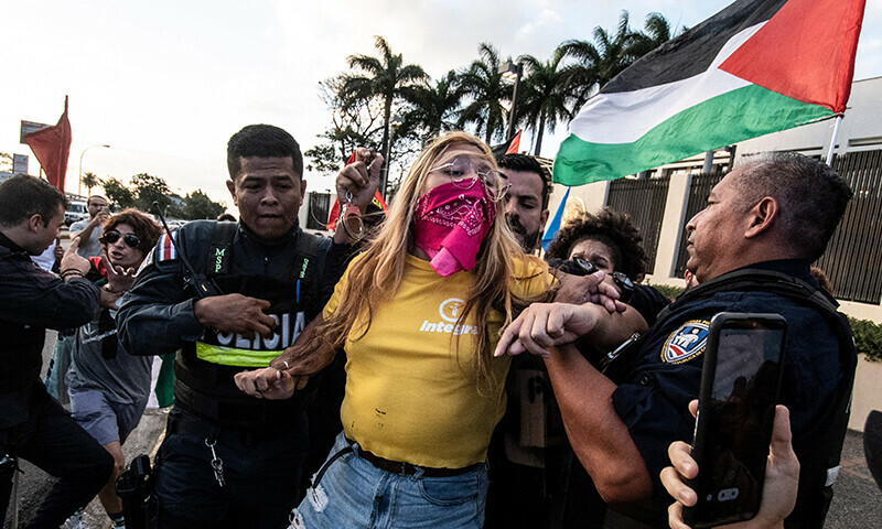 A woman is detained by the police during a demonstration in front of the US embassy in solidarity with the people of Gaza and to protest the US&rsquo; support to Israel, in San Jose, Costa Rica, on January 16. &mdash; AFP