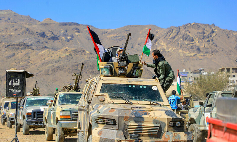 Armed Yemeni supporters of the Houthi movement sit on the back of an armored vehicle during an anti-Israel and anti-US rally in the capital Sanaa on January 22. &mdash; AFP