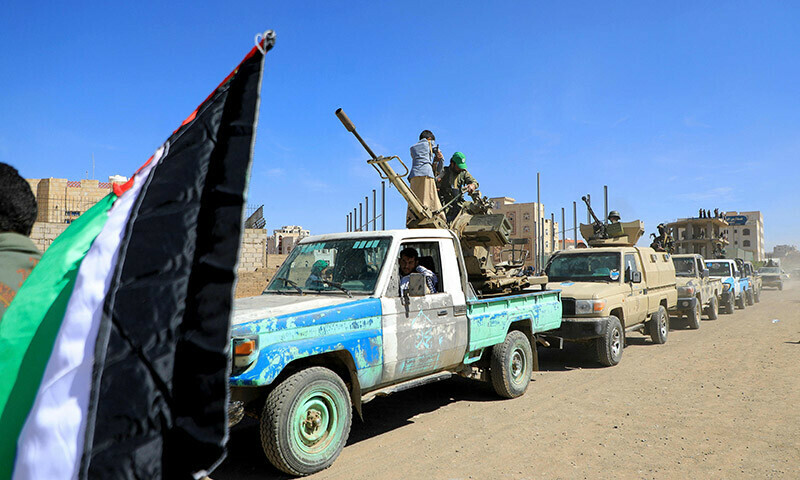 Armed Yemeni supporters of the Houthi movement sit on the back of an armored vehicle during an anti-Israel and anti-US rally in the capital Sanaa on January 22. &mdash; AFP