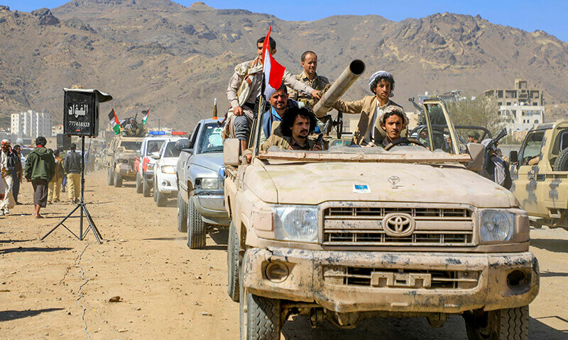 Armed Yemeni supporters of the Houthi movement sit on the back of an armored vehicle during an anti-Israel and anti-US rally in the capital Sanaa on January 22. &mdash; AFP