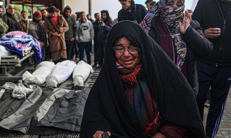 Palestinians wait at a hospital to collect the bodies of their relatives killed in Israeli bombardment in Rafah in the southern Gaza Strip on January 24, 2024 &mdash; AFP