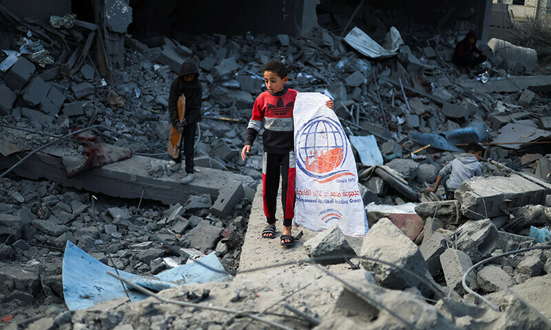 Palestinian children inspect the damage at the site of Israeli strikes on a mosque and houses, in Rafah in the southern Gaza Strip on January 25. &mdash; Reuters