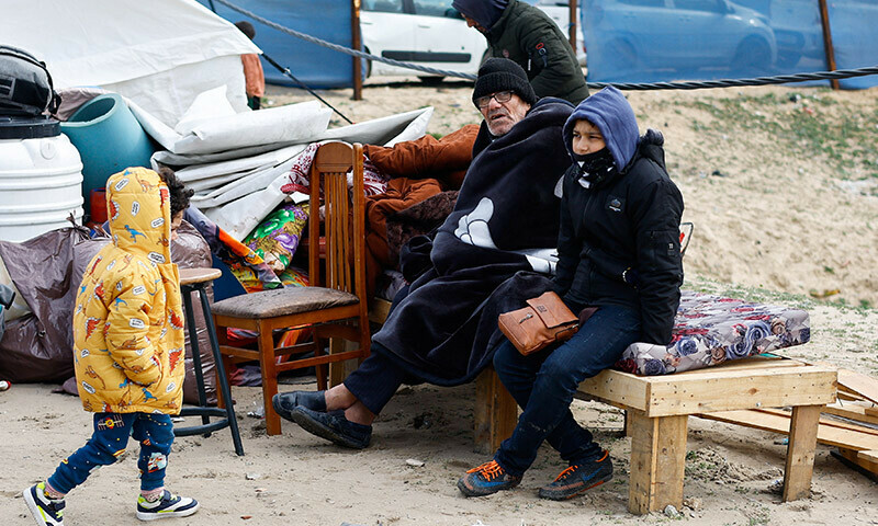 A man looks on as Palestinians fleeing Khan Younis due to the Israeli ground operation arrive in Rafah in the southern Gaza Strip on January 26. &mdash; Reuters