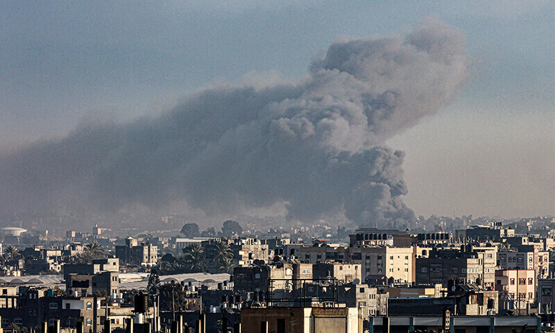 Smoke billow over buildings in Rafah in the southern Gaza Strip during Israeli bombardment on January 29, 2024 &mdash; AFP