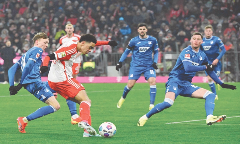 MUNICH: Bayern Munich’s Jamal Musiala shoots to score during the Bundesliga match against Hoffenheim.—AFP MUNICH: Bayern Munich’s Jamal Musiala shoots to score during the Bundesliga match against Hoffenheim.—AFP