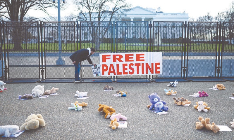 Plush toys for young Palestinian victims are placed in front of the White House as protesters rally during the “March on Washington for Gaza”, on Saturday.—AFP