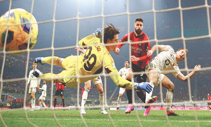 MILAN: Olivier Giroud (second R) of AC Milan scores against Roma during their Serie A match at San Siro.—Reuters MILAN: Olivier Giroud (second R) of AC Milan scores against Roma during their Serie A match at San Siro.—Reuters