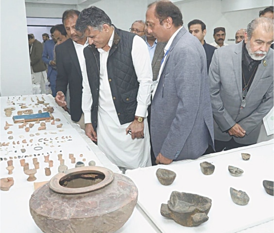 Government officials admire artefacts displayed at the lab.&mdash;Dawn