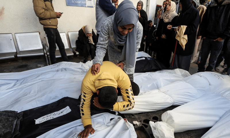 Mourners react next to bodies of Palestinians, most of whom were killed in Israeli strikes at Abu Yousef al-Najjar hospital in Rafah in the southern Gaza Strip on Feb 8, 2024. — AFP