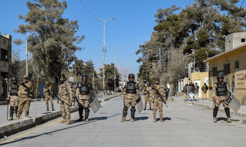 Frontier Corps Balochistan (North) personnel stand guard during a protest outside the office of a Returning Officer in Quetta on February 9, 2024, against the alleged rigging in Pakistan&rsquo;s national election results. &mdash; AFP